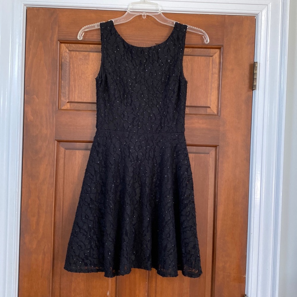 Lace black dress with light sparkles will leave you Speechless.
